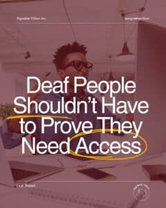 A person gesturing in a workplace, engaged while seated at a desk with notebooks and laptops nearby. Text reads: “Deaf People Shouldn’t Have to Prove They Need Access.” SignAble Vi5ion branding and Leah Riddell’s name appear on the image.