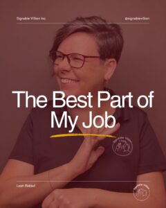 A smiling woman with short hair and glasses sits against a plain background wearing a black SignAble Vi5ion Inc. polo shirt. She is signing the ASL sign for "interesting" with her right hand near her chest while looking off to the side. Large white text reads "The Best Part of My Job," with SignAble Vi5ion Inc. branding at the top and the company logo in the bottom right corner.